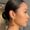 textured gold heart linear drop earrings with orange metal bead