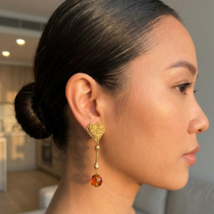 textured gold heart linear drop earrings with orange metal bead